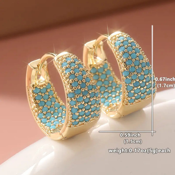 Elegantes aros de oro con perlas turquesas